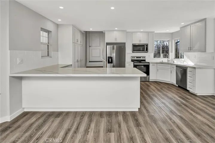 Pretty quartz counters and a convenient breakfast bar.