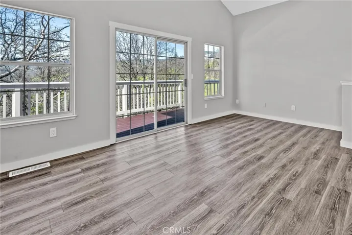 "sunken" living room on its own split level opens to back deck