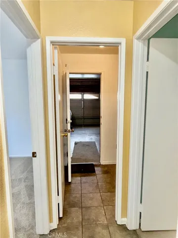 HALLWAY TO LAUNDRY ROOM AND GARAGE