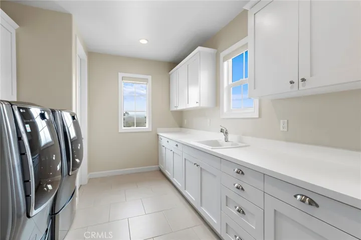 Upstairs laundry room with tons of storage