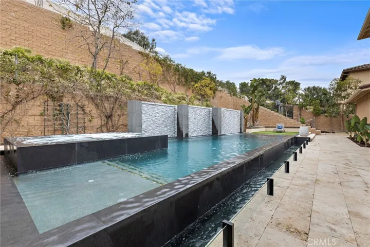 Complete with an infinity pool, spa, travertine decking, outdoor shower,