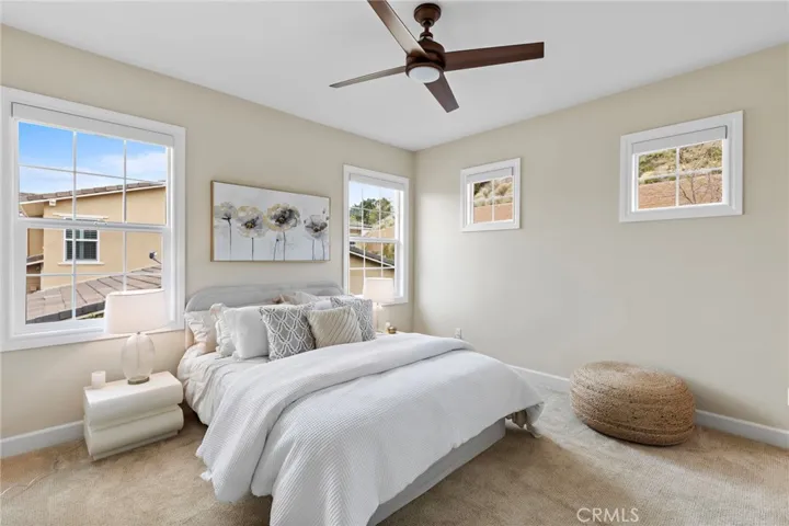 Bedroom one upstairs with high ceilings and tons of sunlight