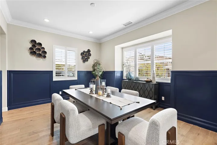 Full-sized formal dining room with attached wet bar