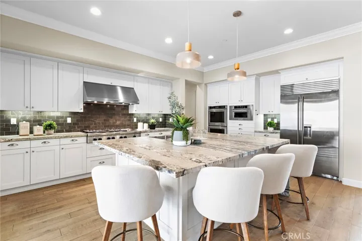 Top of the line appliances with large leathered granite island