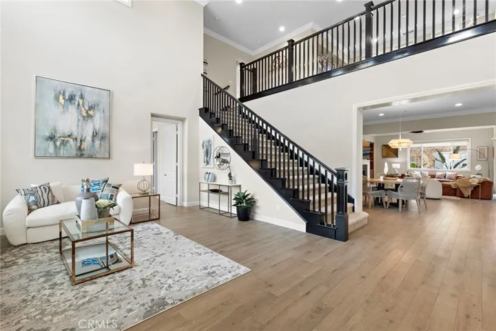 Soaring 26 foot ceilings with grand stairway