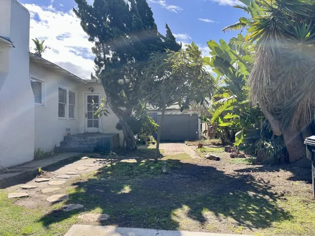 Side yard, the driveway side.
