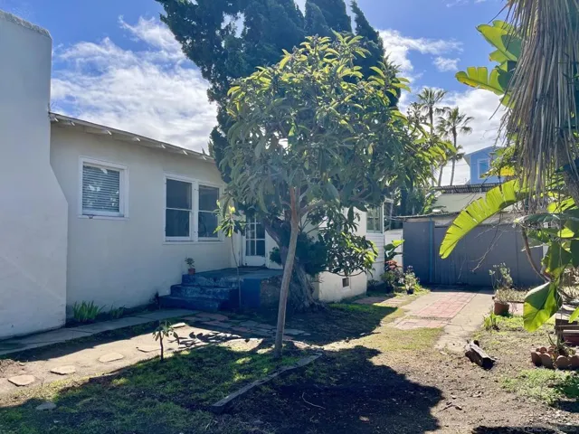 Side yard, the driveway side. This photo taken after the side fence was removed.