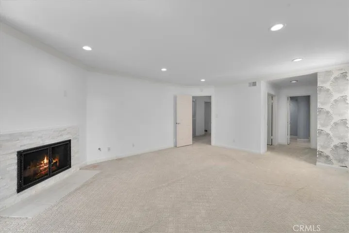 The entire downstairs has had brand new vinyl floors installed since the photos were taken.