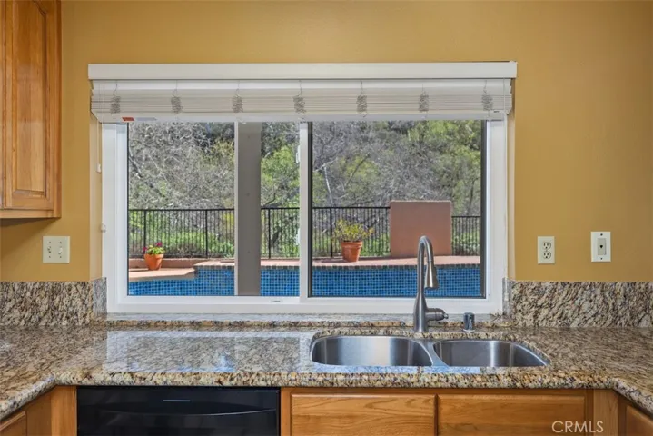 Great view of the pool and Serrano Creek area from kitchen window.