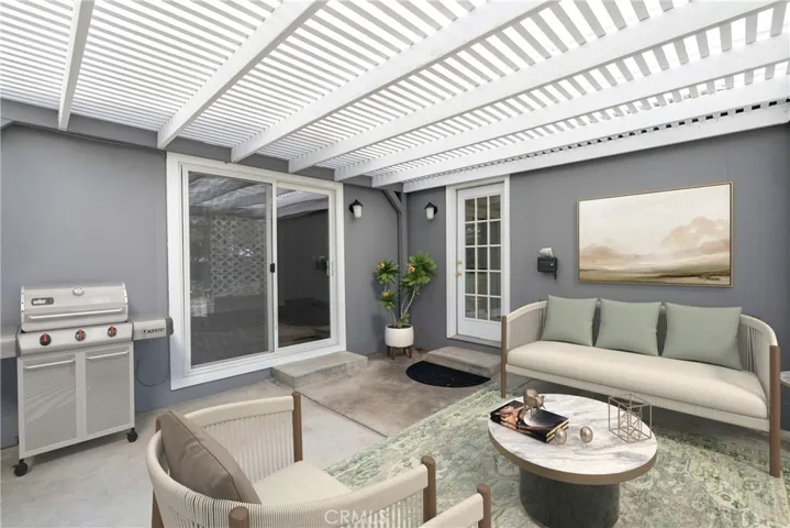 Outdoor living flows from both the great room & the kitchen (virtually staged)