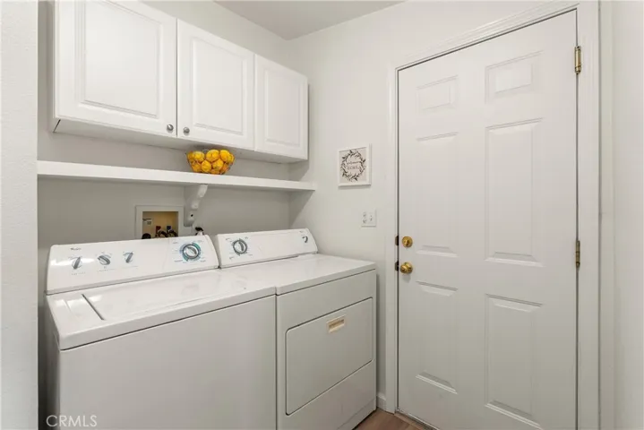 Indoor laundry room leads to the garage
