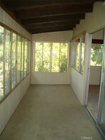 Lower Floor Enclosed Porch Area Off of the TwoBedrooms