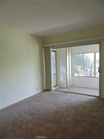 Lower Floor 2nd Bedroom with Direct Access to Enclosed Porch Area