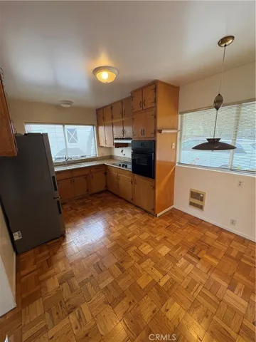 Main Floor Kitchen Area with Stainless Steel Appliances, Granite Countertops, and Breakfast Nook Dining Area