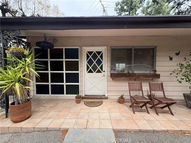 Front Exterior of Home with Front Door Entrance and Patio Area