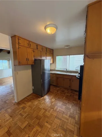 Main Floor Kitchen Area with Adjacent Access to Main Floor Living Room Area