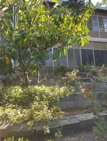 Backyard Garden Area Adjacent to Rear of Home and Upper and Lower Enclosed Porch Areas
