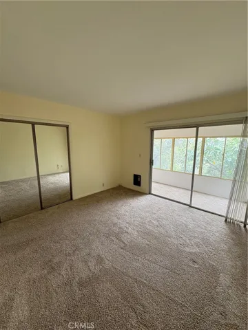 Lower Floor Master Bedroom with Direct Access to Enclosed Porch Area