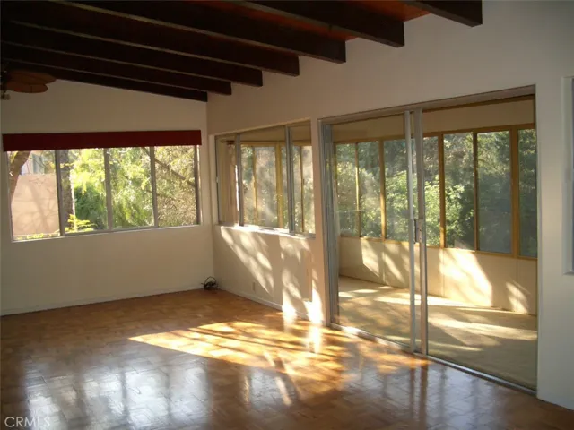 Main Floor Living Room Area with Direct Access to Enclosed Porch Area