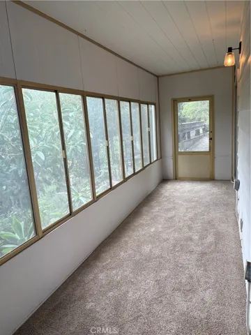 Lower Floor Enclosed Porch Area Adjacent to Two Bedrooms