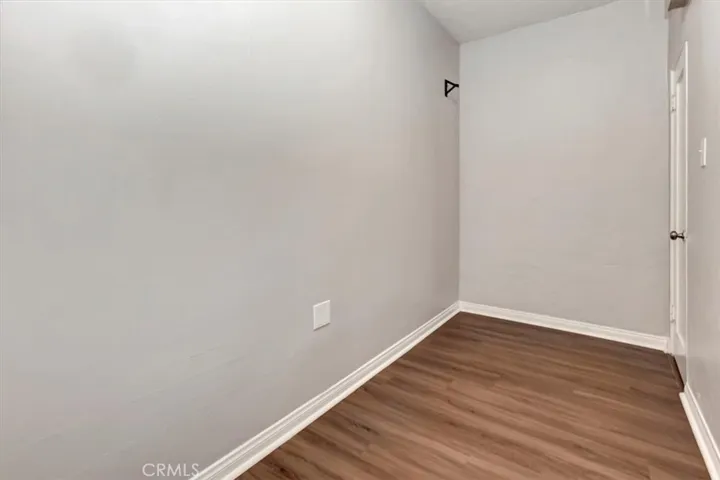 Large closet outside bedroom and bathroom
