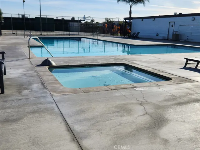 Pool 1st View of Pool with Hot Tub Next to Clubhouse, Basketball Courts, Handball Courts and Playground Fof Kids
