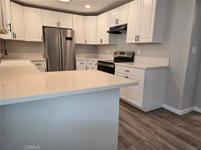 Kitchen area - New cabinets/faucet/sink/
Refrigerator/Lighting