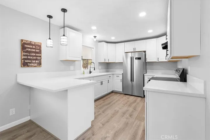 Kitchen area - New cabinets/faucet/sink/
Refrigerator/Lighting