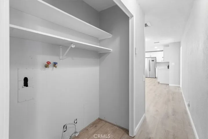 Washer and Dryer Hookups in Hallway from Bedroom 1 to Dining Room