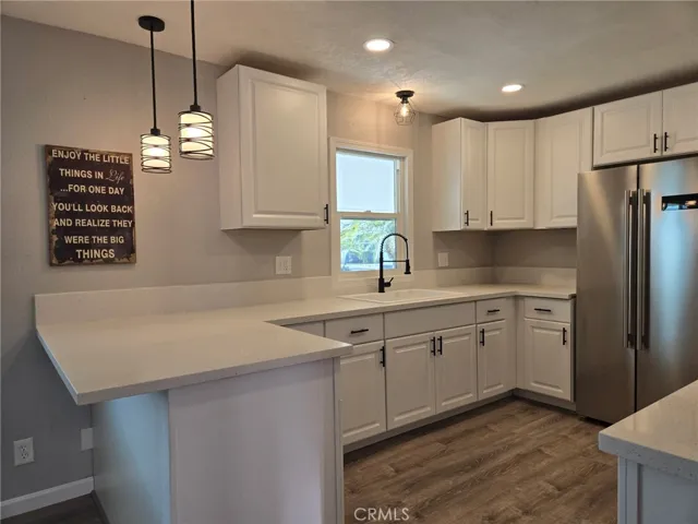 Kitchen area - New cabinets/faucet/sink/
Refrigerator/Lighting