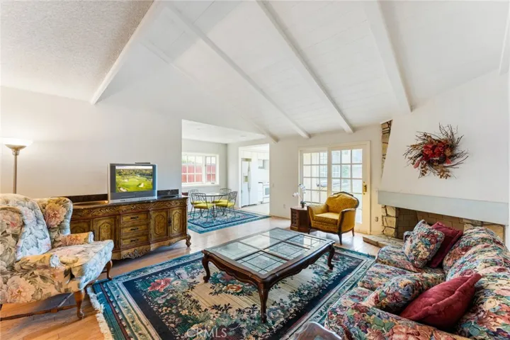 Open concept family room, raised beam ceilings, hardwood floors, fireplace