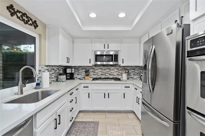 Gorgeous remodeled kitchen with stainless steel appliances.
