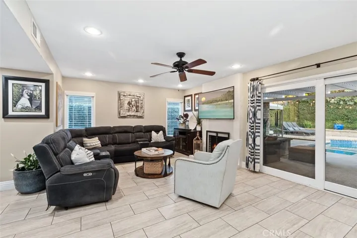 Relax in this large family room with newer flooring and remodeled fireplace.
