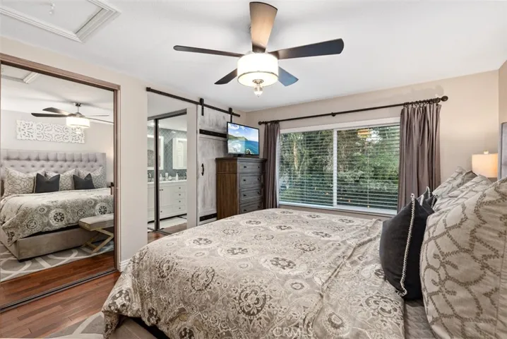 Primary Bedroom with 2 large closets & a pull down ladder for a large attic storage area.