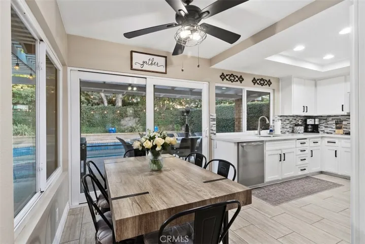 Remodeled kitchen with causal dining area with view of the amazing backyard.