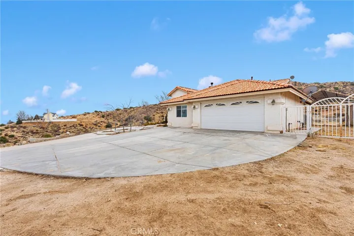 Attached Garage and paved driveway