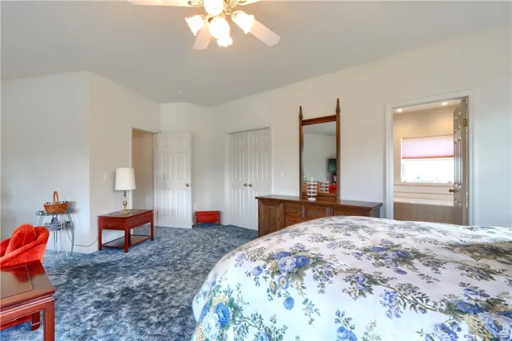 Primary with walk in closet and deck access.