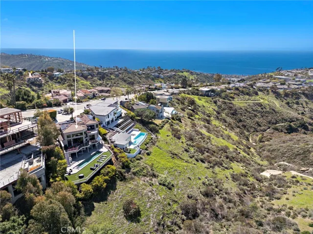 A generous homesite of nearly .38 acres is introduced by wide street frontage and a circular driveway, making arriving and departing easy while creating exceptional privacy.