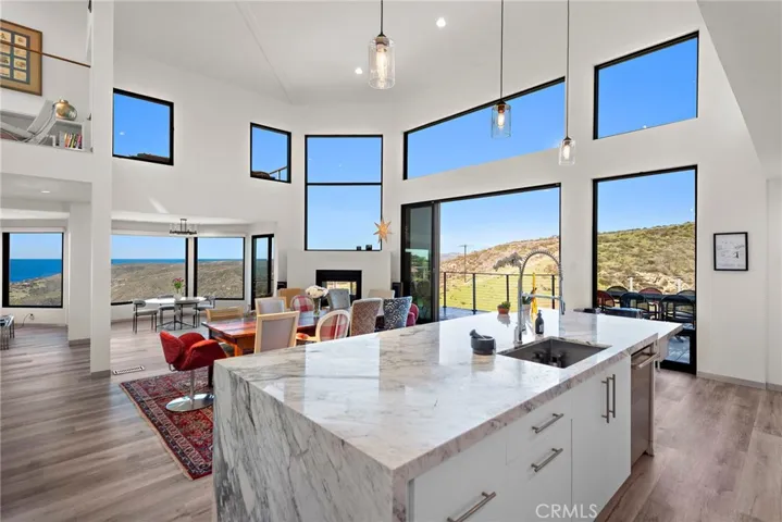 Experience breathtaking ocean and canyon views from this newly renovated Laguna Beach pool-home retreat that seamlessly integrates nature into every aspect of life.