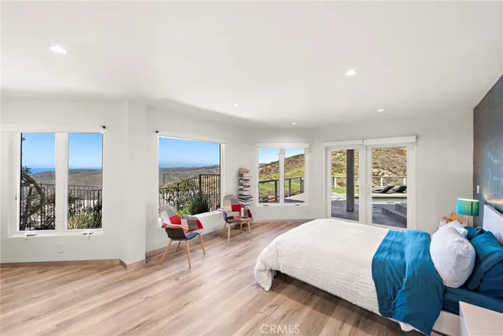 Two additional ocean-view suites await on the lowest floor and share a large fireplace-warmed secondary living room with bar for entertaining.
