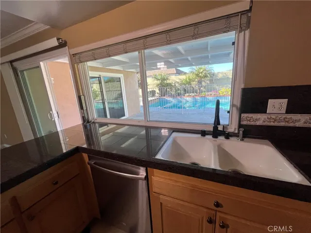view to pool from family room and kitchen