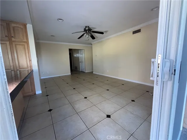 sliding glass door leads to covered patio in the backyard