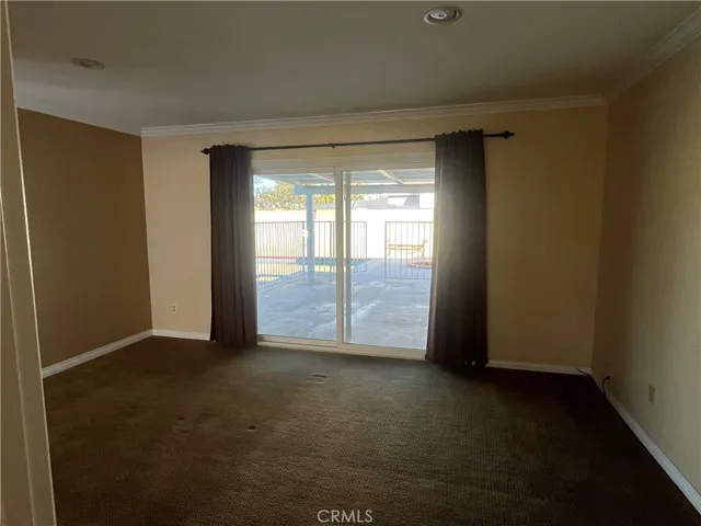 Primary suite has sliding glass door that leads to backyard covered patio