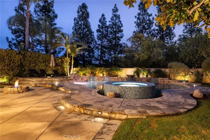 Spacious raised spa with water feature