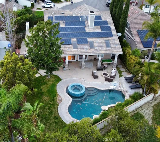 Spacious 12,000 SqFt flat lot with large grassy yard, pool & spa, large covered patio & outdoor kitchen, owned solar system at end of cul-de-sac