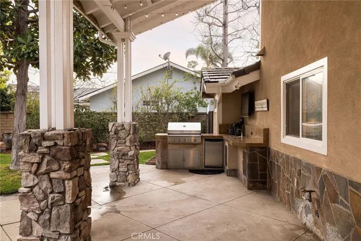 Outdoor kitchen with BBQ, refrigerator
