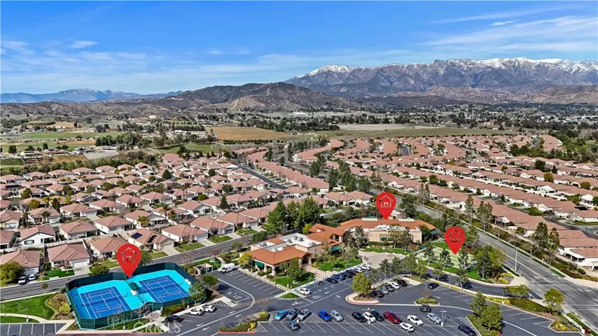 Aerial community pickleball, bocce ball, and pool areas
