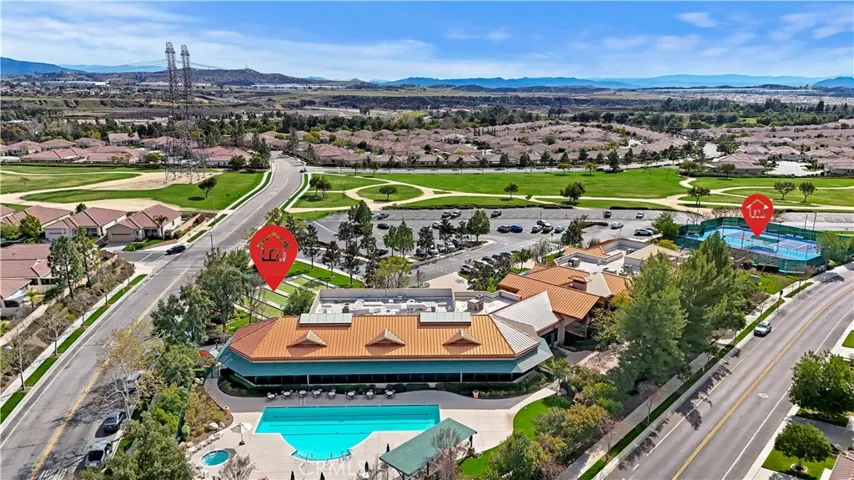 Aerial community pool, bocce ball, pickleball, and community center area.