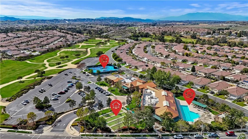 Aerial community pool, bocce ball, pickleball, and community center area.