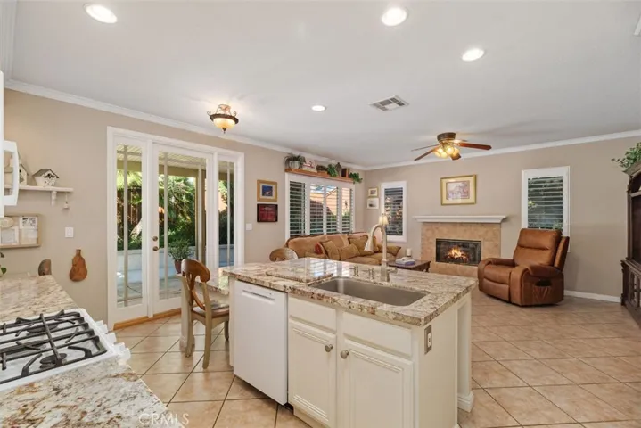 Open Kitchen connecting to the Family Room and Outdoor Living Space.